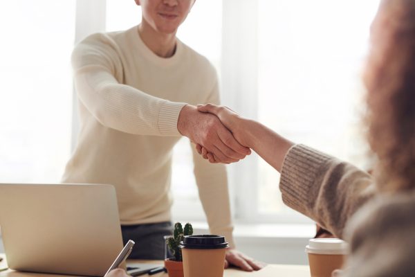 man-woman-shaking-hands-pre-tenancy-agreement