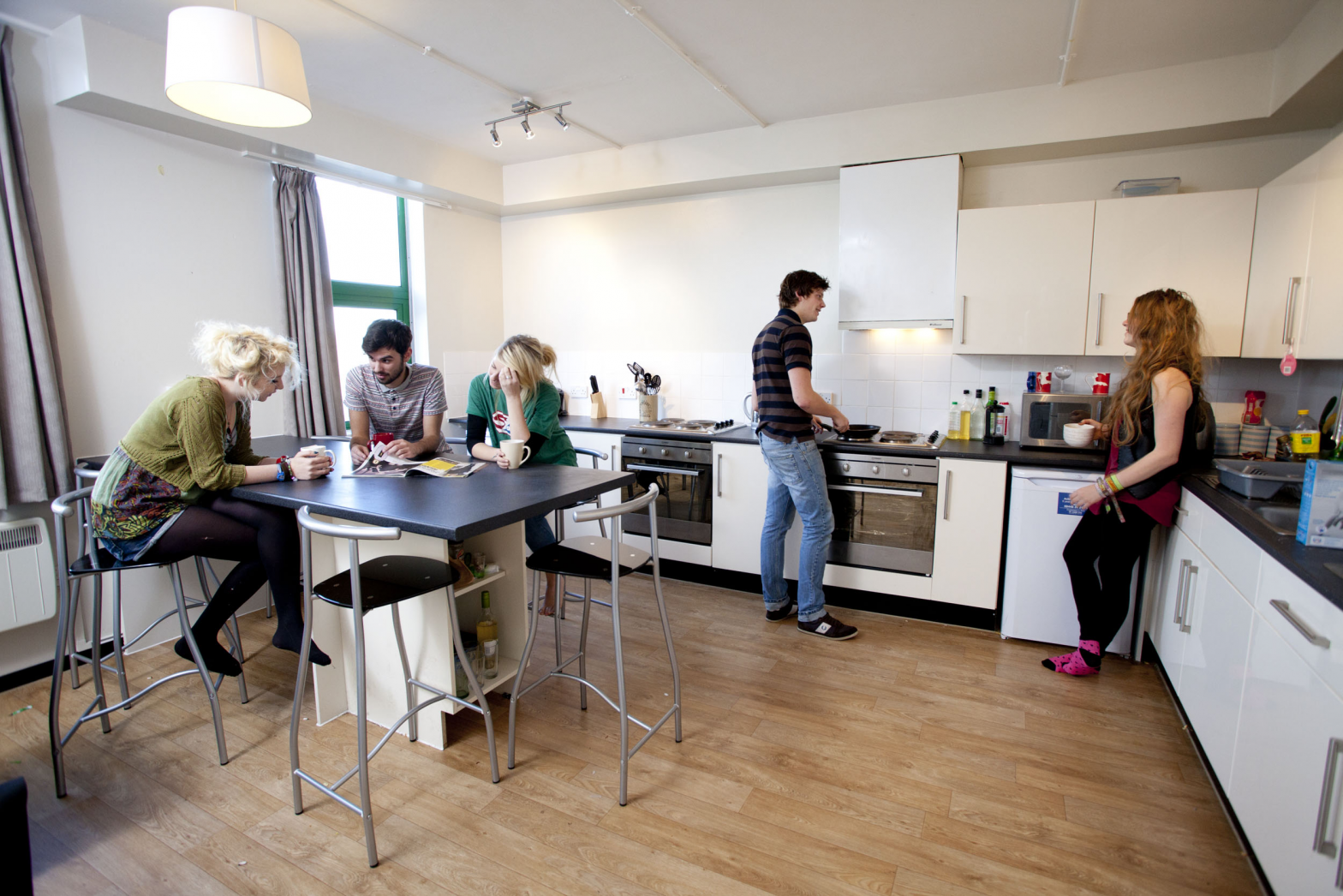 students cooking in the kitchen of a flat